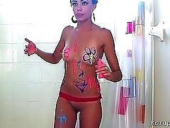 Cutie covers her hot body in neon body paint