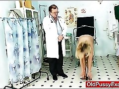 Doctor visit for a blonde looks inside her pussy