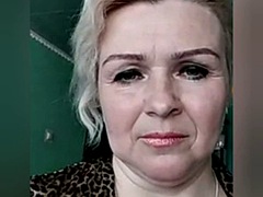 Russian woman strips naked in front of the camera and masturbates
