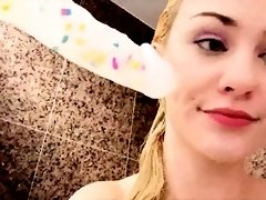 Stacked blonde camgirl has fun with sex toys in the shower