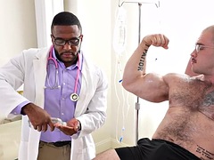 Amateur muscled dude masturbated and massaged by a black doctor