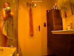 Slim young girl with tiny boobs takes a shower on hidden cam